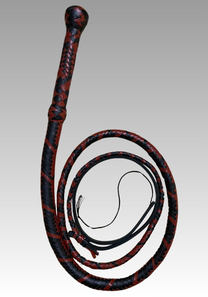 Red and black braided leather bullwhip with a rounded handle end and coiled lash