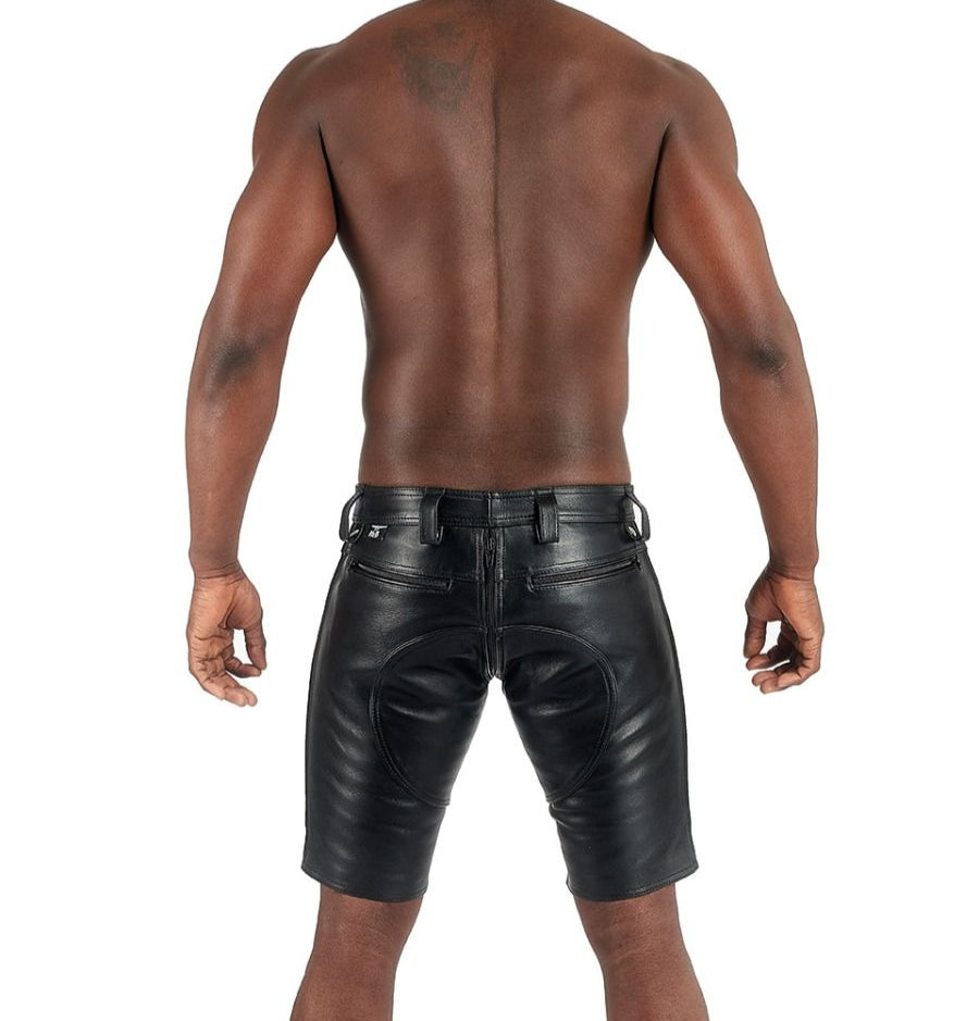 Man wearing black leather shorts on a white background