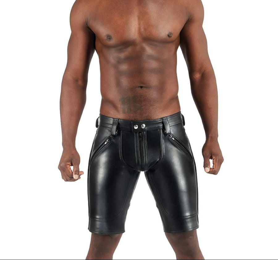 Man wearing black leather shorts on a white background