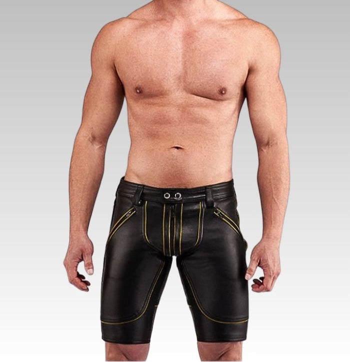 Man wearing black leather shorts with gold stitching for sale