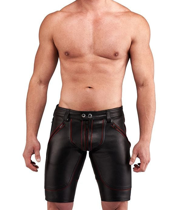 Man wearing black leather shorts with red stitching for sale