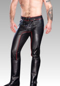 Man wearing black leather pants with red stitching on a gray background