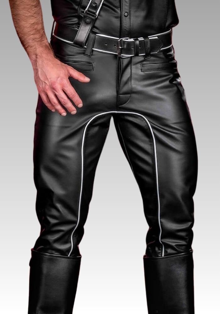 Black leather pants with white piping worn by a person on a gray background