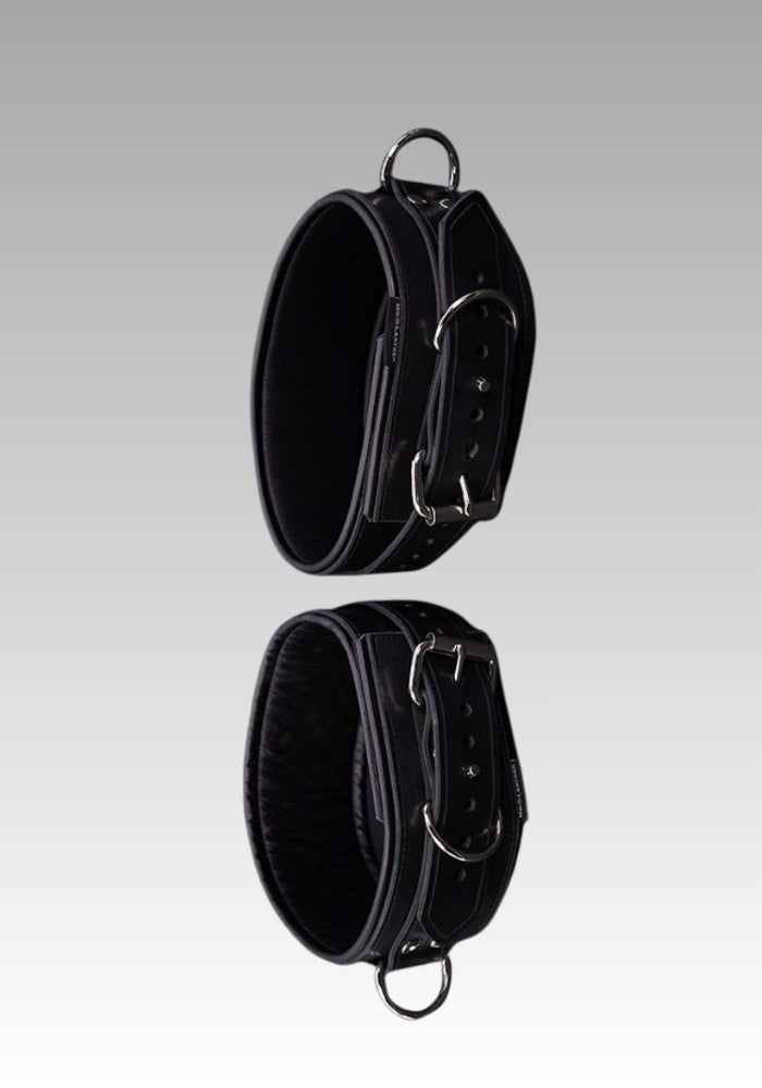 Black leather belt with a padlock on a person's leg for sale