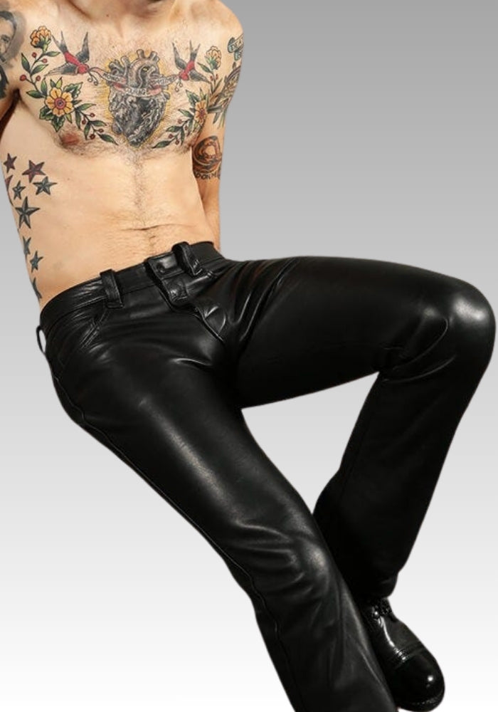 Person wearing black leather pants with tattoos for sale