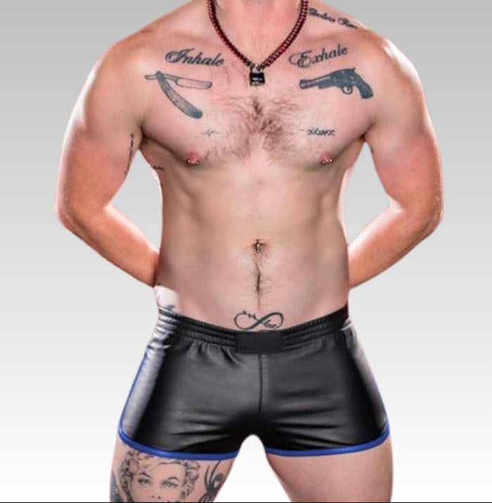 Man with tattoos wearing black shorts for sale 