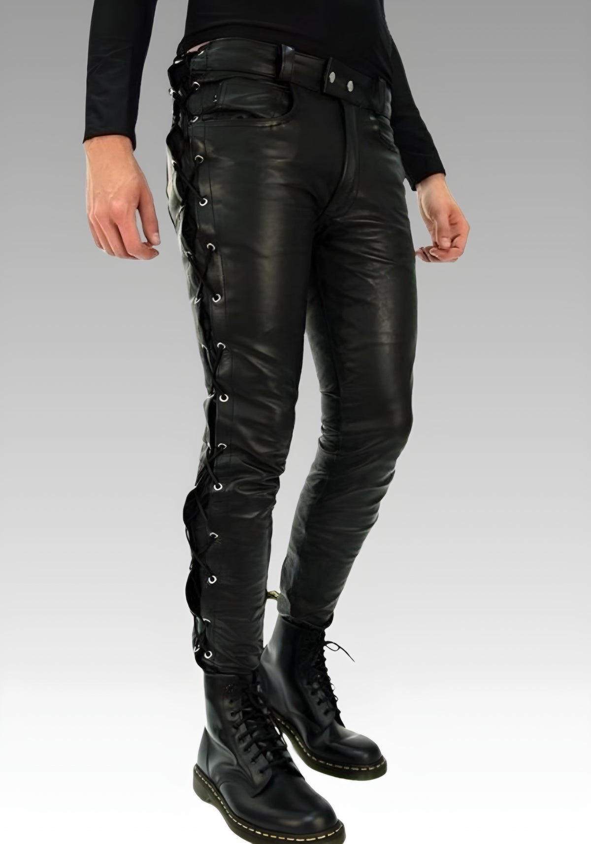Three-quarter view of the side-laced leather pants and low-rise waistband