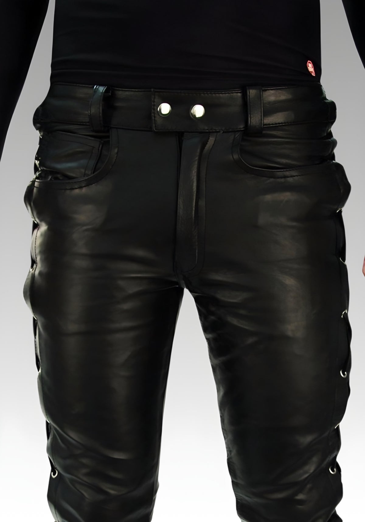 Front waist detail of the biker leather pants with zipper fly, pockets and belt loops