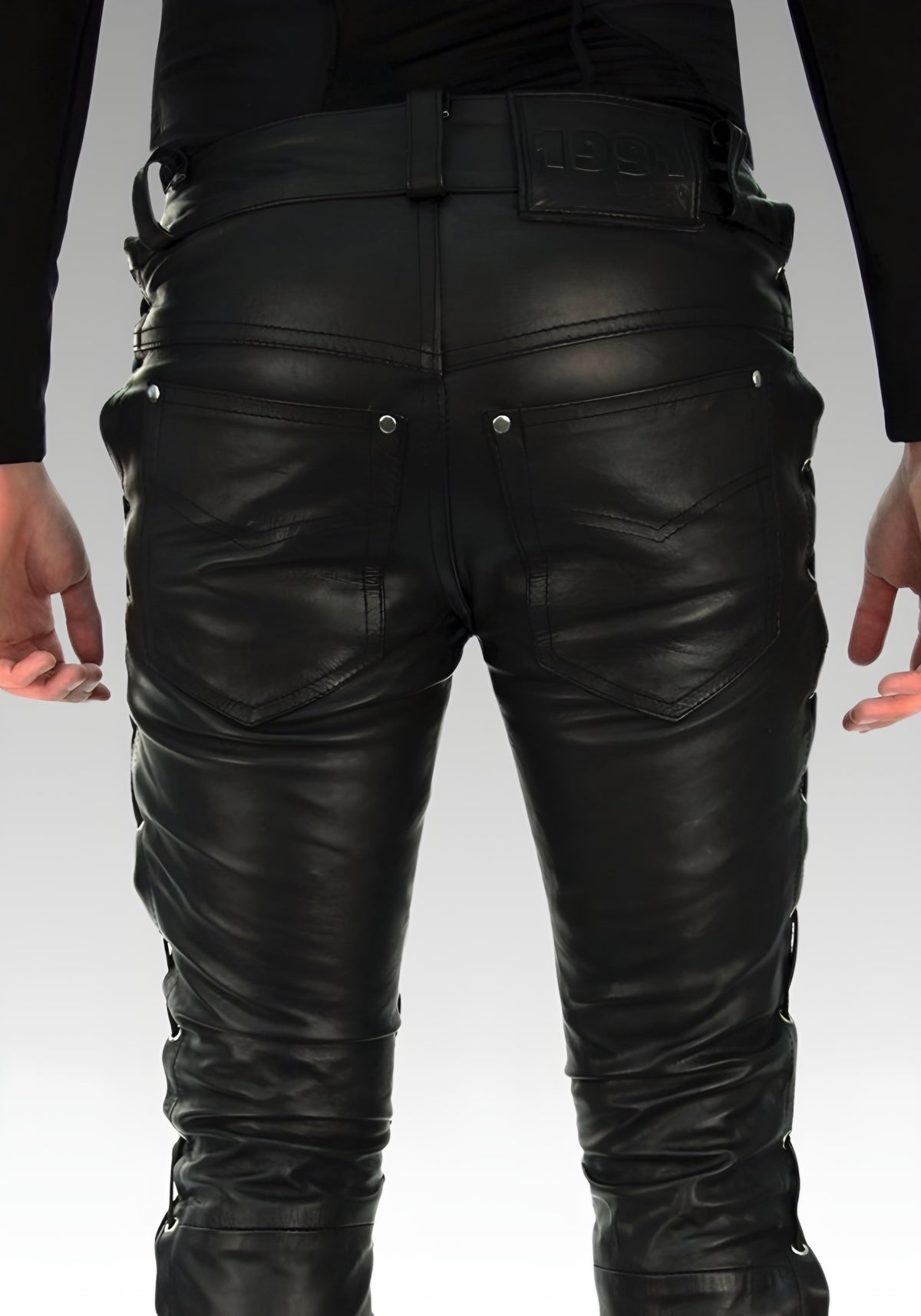Rear view of the black side-laced biker pants with two back pockets