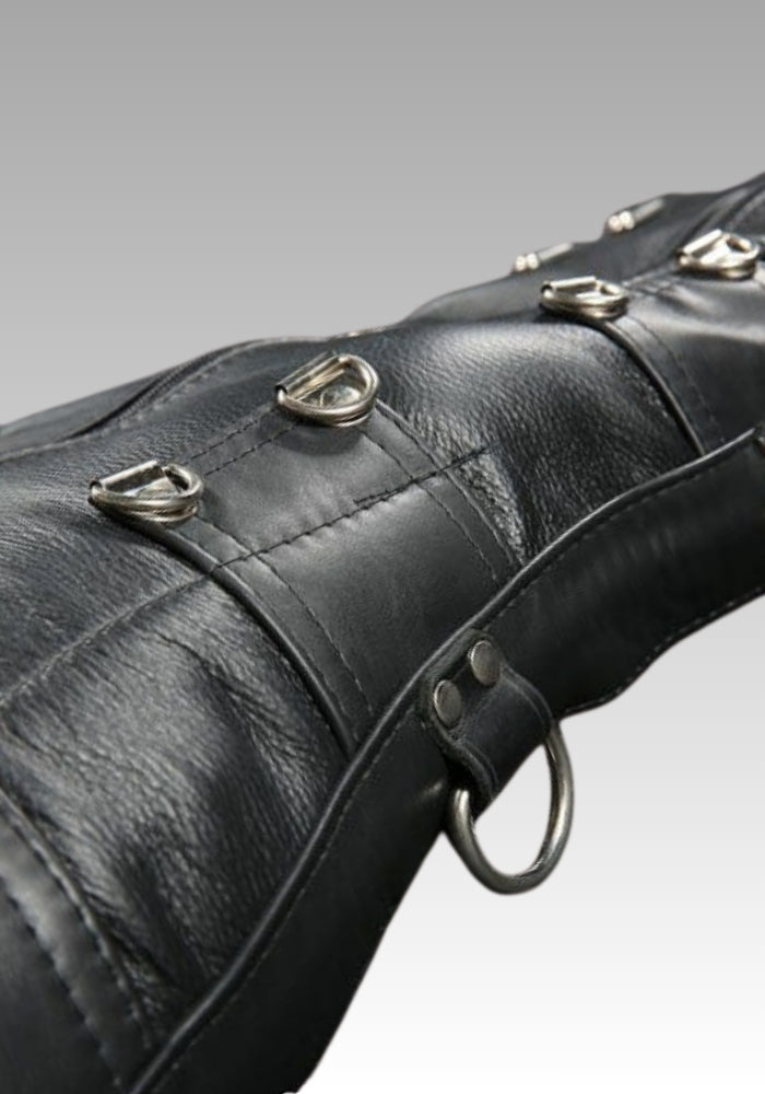 Side detail of the leather sleepsack showing riveted straps and metal D-rings