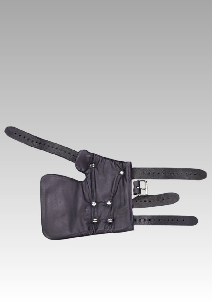 Black leather hand restraint laid flat with multiple buckle straps